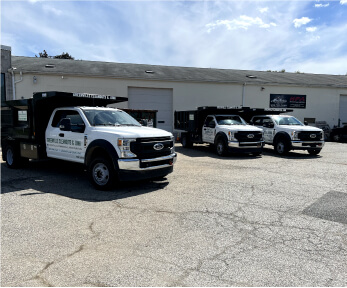 A fleet of vehicles at the Greenville Junk lot, ready for junk hauling