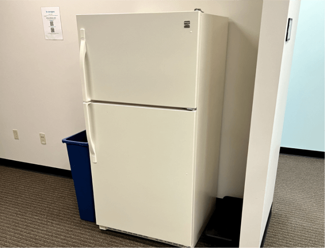 Refrigerator awaiting removal in a tenant's Delaware home